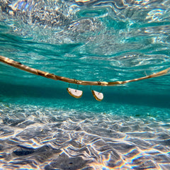 Doraluna | Handcrafted white ceramic dangle earrings with gold luster