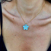 Margherita | Handcrafted light blue floral ceramic necklace with golden detail